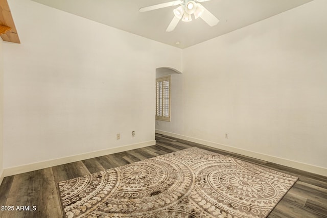 13609 W Vermont Ave, Litchfield Park, AZ 85340 - empty room featuring wood finished floors, arched walkways, baseboards, and ceiling fan