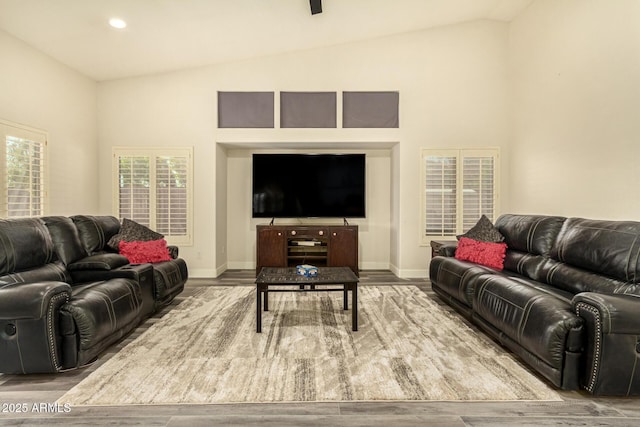 13609 W Vermont Ave, Litchfield Park, AZ 85340 - living room with baseboards, lofted ceiling, and wood finished floors