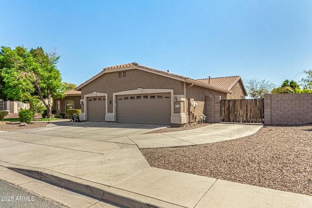 13609 W Vermont Ave, Litchfield Park, AZ 85340 - view of front of property featuring a tiled roof, stucco siding, concrete driveway, and a garage