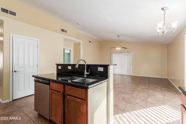 kitchen with a center island with sink, ceiling fan with notable chandelier, sink, stainless steel dishwasher, and decorative light fixtures