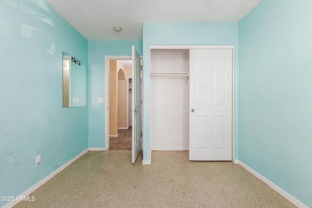 unfurnished bedroom featuring a closet