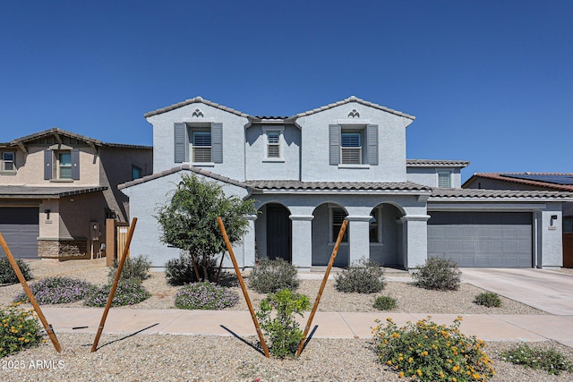 25051 N 140th Dr, Surprise, AZ 85387 - mediterranean / spanish home with a porch, a tiled roof, concrete driveway, an attached garage, and stucco siding