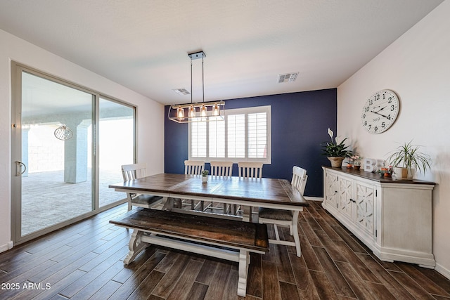 25051 N 140th Dr, Surprise, AZ 85387 - dining space featuring dark wood-style flooring, a chandelier, and baseboards