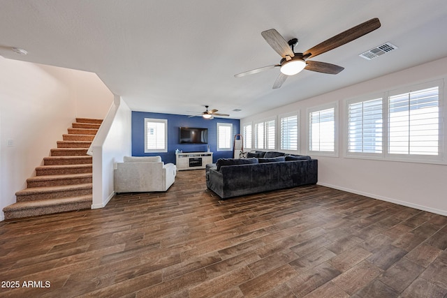 25051 N 140th Dr, Surprise, AZ 85387 - living room featuring stairs, dark wood-style flooring, a ceiling fan, and baseboards