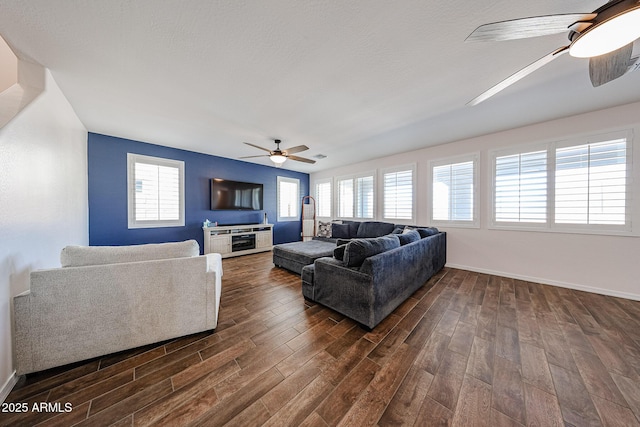 25051 N 140th Dr, Surprise, AZ 85387 - living room featuring ceiling fan, dark wood finished floors, and baseboards