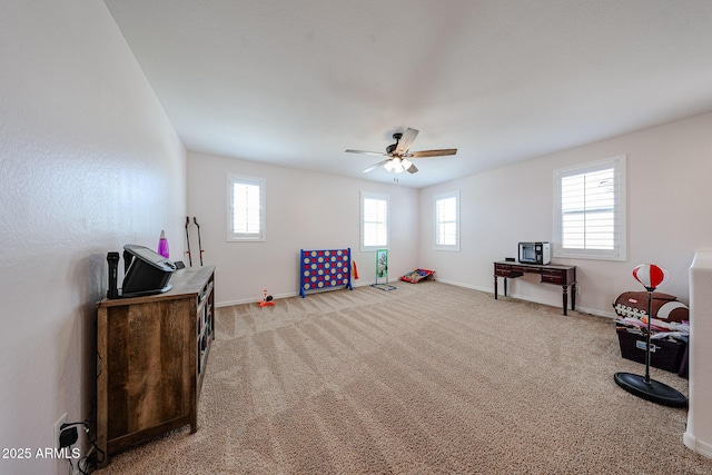 25051 N 140th Dr, Surprise, AZ 85387 - recreation room featuring healthy amount of natural light, baseboards, and light carpet