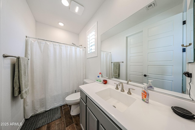25051 N 140th Dr, Surprise, AZ 85387 - bathroom with wood finished floors, toilet, vanity, and a shower with curtain