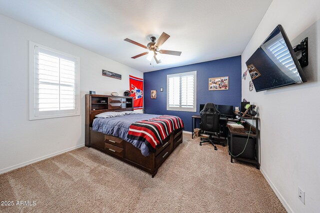 25051 N 140th Dr, Surprise, AZ 85387 - bedroom featuring light carpet, a desk, and baseboards