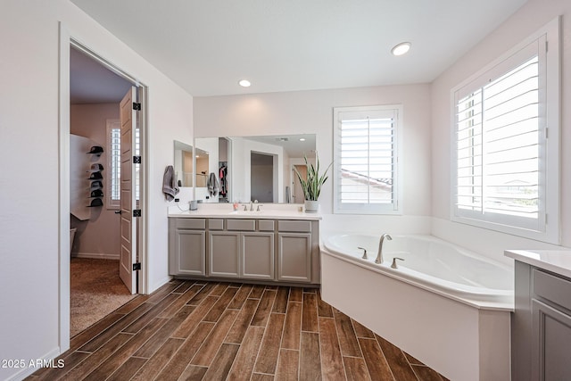 25051 N 140th Dr, Surprise, AZ 85387 - bathroom featuring vanity, plenty of natural light, wood finished floors, and recessed lighting