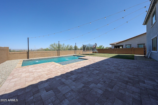 25051 N 140th Dr, Surprise, AZ 85387 - view of pool with a trampoline, a patio area, and a fenced backyard