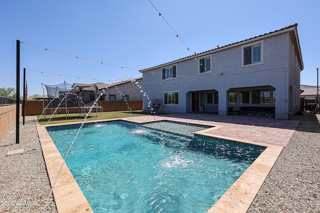 25051 N 140th Dr, Surprise, AZ 85387 - view of pool featuring a trampoline, a fenced backyard, and a patio area
