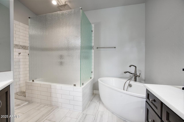 bathroom featuring a soaking tub, vanity, and a walk in shower