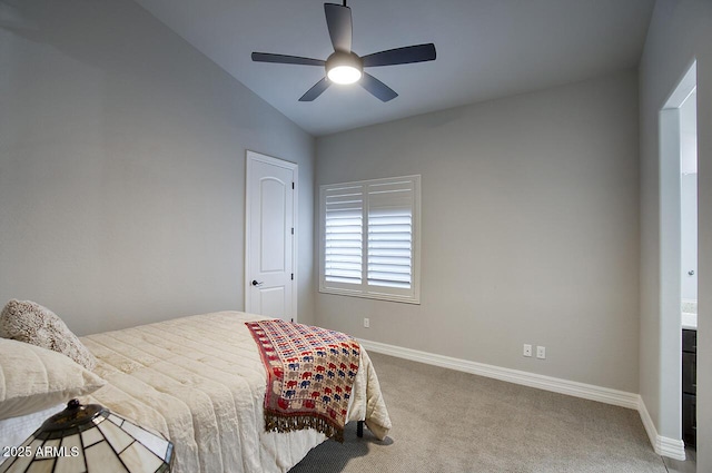 carpeted bedroom with a ceiling fan and baseboards