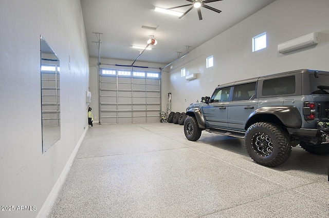 garage with a wall unit AC and baseboards