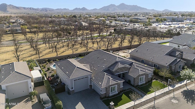 drone / aerial view featuring a residential view and a mountain view