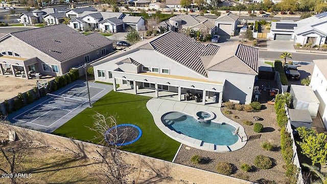 birds eye view of property with a residential view