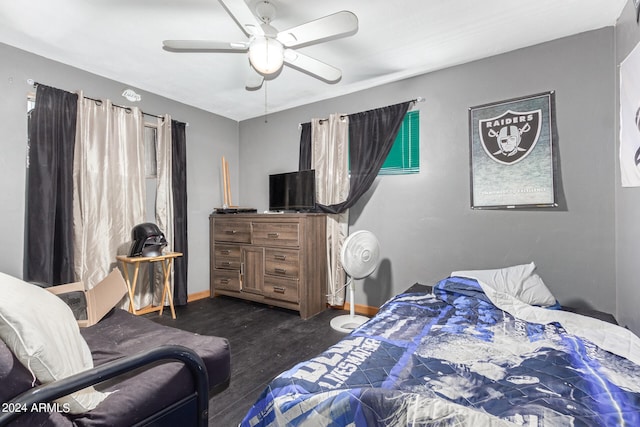 bedroom with ceiling fan and dark wood-type flooring