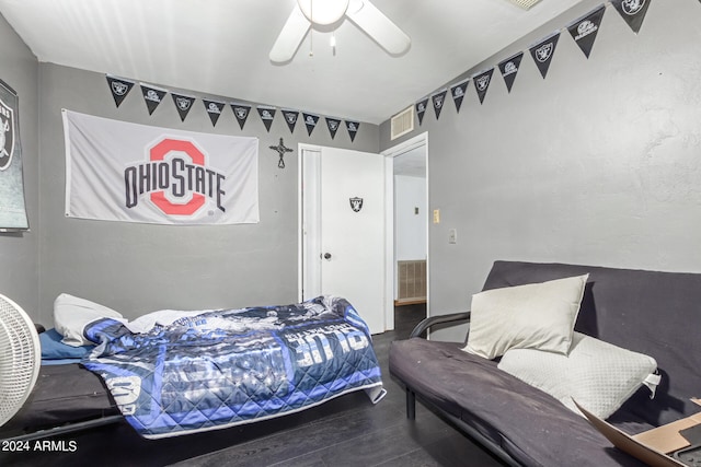 bedroom featuring ceiling fan and dark hardwood / wood-style floors