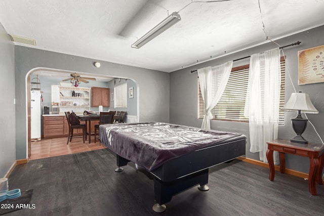 playroom featuring pool table, ceiling fan, and dark hardwood / wood-style flooring