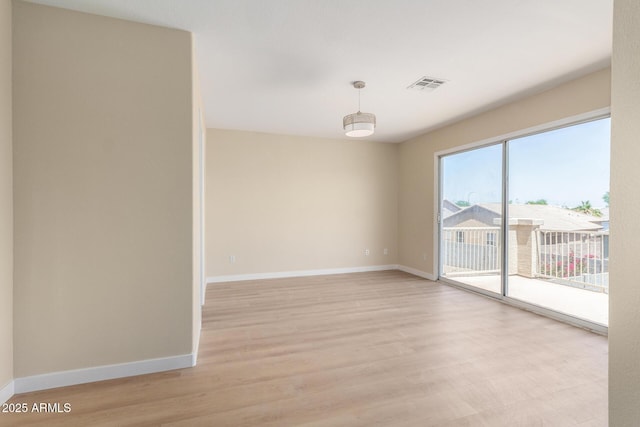 12426 W Adams St, Avondale, AZ 85323 - spare room featuring light wood finished floors and baseboards