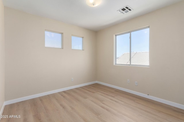 12426 W Adams St, Avondale, AZ 85323 - spare room featuring light wood-style flooring and baseboards