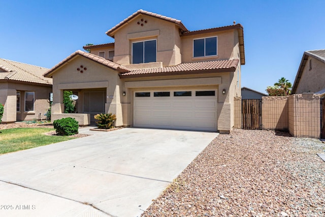 12426 W Adams St, Avondale, AZ 85323 - mediterranean / spanish-style home featuring stucco siding, concrete driveway, a tiled roof, and an attached garage