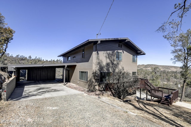 exterior space featuring a mountain view and driveway