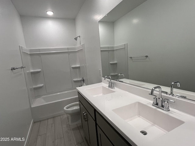 full bathroom with vanity, toilet, bathing tub / shower combination, and hardwood / wood-style floors