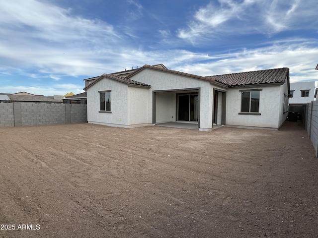 back of property with a patio area