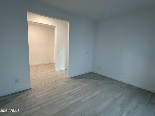 unfurnished room with light hardwood / wood-style flooring