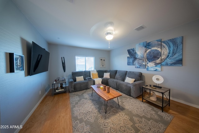2361 N 212th Dr, Buckeye, AZ 85396 - living area featuring wood finished floors and ceiling fan