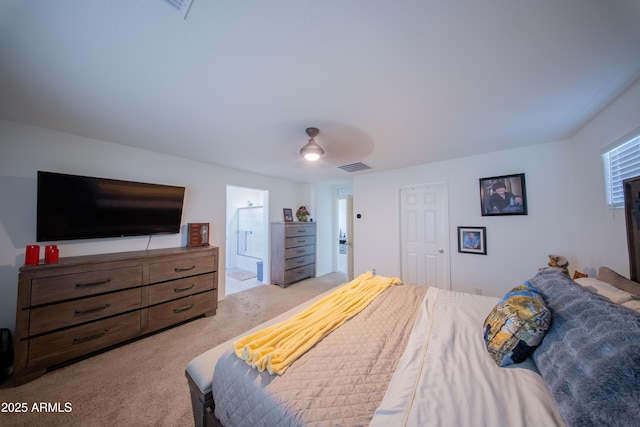 2361 N 212th Dr, Buckeye, AZ 85396 - bedroom with light carpet, ensuite bath, and ceiling fan