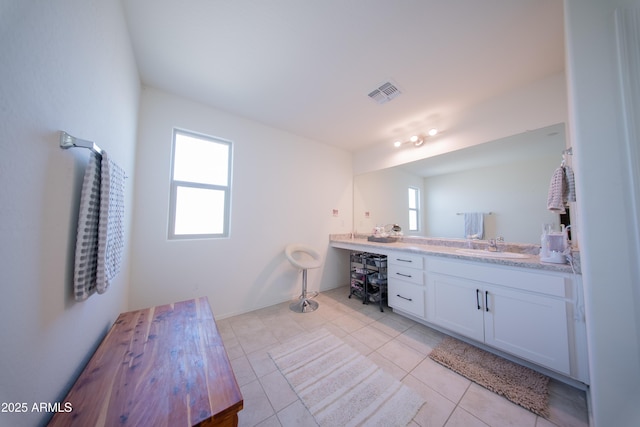 2361 N 212th Dr, Buckeye, AZ 85396 - bathroom featuring healthy amount of natural light, double vanity, and tile patterned flooring