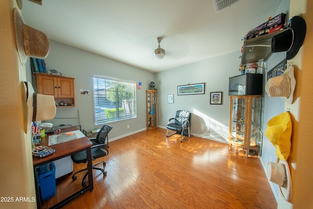 2361 N 212th Dr, Buckeye, AZ 85396 - office area with light wood-type flooring and a ceiling fan