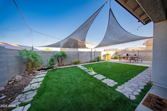 2361 N 212th Dr, Buckeye, AZ 85396 - fenced backyard with a patio area