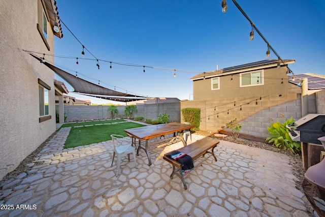 2361 N 212th Dr, Buckeye, AZ 85396 - fenced backyard featuring outdoor dining area and a patio