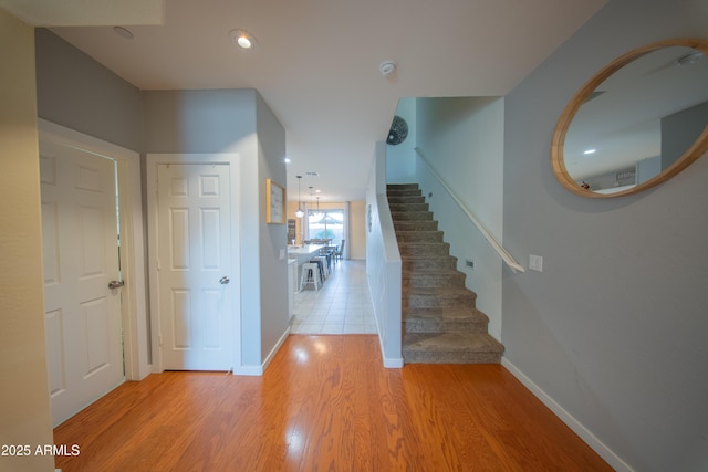 2361 N 212th Dr, Buckeye, AZ 85396 - entrance foyer featuring wood finished floors, stairs, and recessed lighting