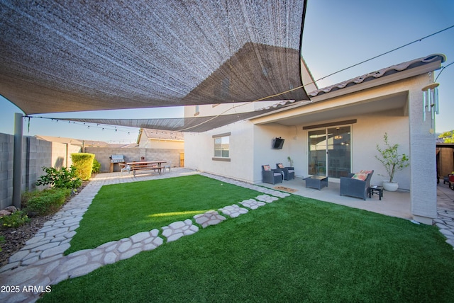 2361 N 212th Dr, Buckeye, AZ 85396 - fenced backyard with a patio and an outdoor living space