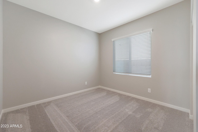 unfurnished room featuring carpet flooring