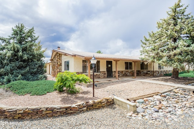 1170 N Broken Wagon Trl, Dewey, AZ 86327 - view of front of property with stone siding, stucco siding, and a patio area