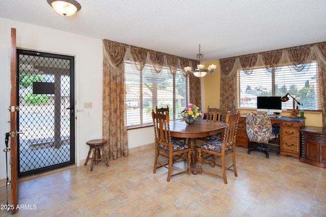 1170 N Broken Wagon Trl, Dewey, AZ 86327 - dining area with a textured ceiling and a chandelier