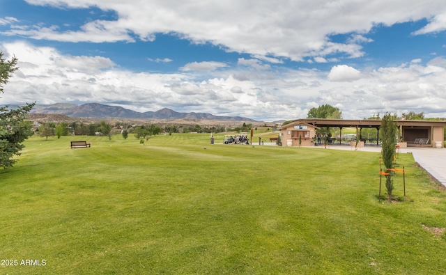 1170 N Broken Wagon Trl, Dewey, AZ 86327 - view of home's community featuring a mountain view, a lawn, and an outbuilding