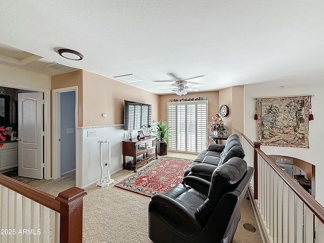 1350 E Racine Dr, Casa Grande, AZ 85122 - carpeted living room featuring visible vents, a textured ceiling, and ceiling fan
