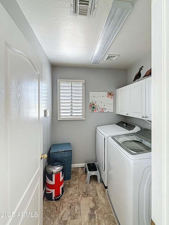 1350 E Racine Dr, Casa Grande, AZ 85122 - washroom with cabinet space, visible vents, washer and dryer, and a textured ceiling
