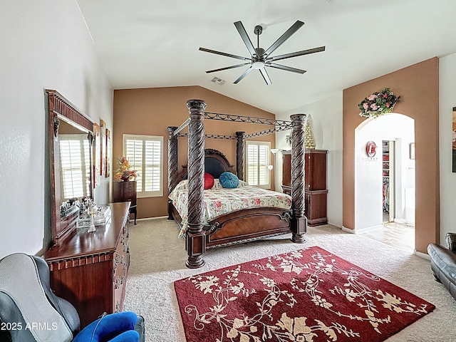 1350 E Racine Dr, Casa Grande, AZ 85122 - carpeted bedroom with arched walkways, visible vents, vaulted ceiling, and ceiling fan