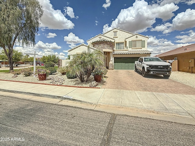 1350 E Racine Dr, Casa Grande, AZ 85122 - view of front facade with stone siding, a garage, decorative driveway, and stucco siding
