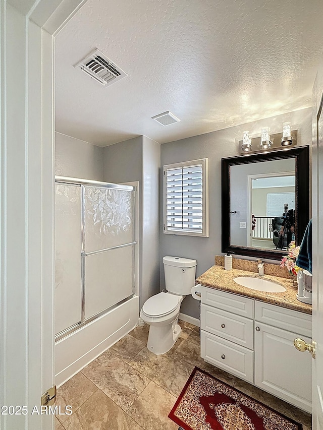 1350 E Racine Dr, Casa Grande, AZ 85122 - bathroom featuring toilet, a textured ceiling, vanity, and visible vents