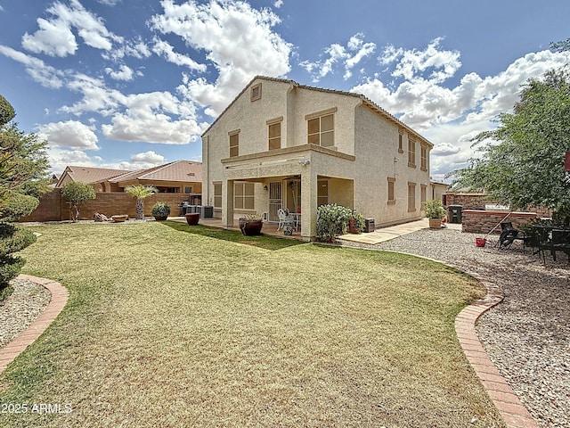 1350 E Racine Dr, Casa Grande, AZ 85122 - rear view of property featuring a patio, stucco siding, fence, and a lawn