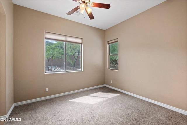 carpeted empty room with ceiling fan