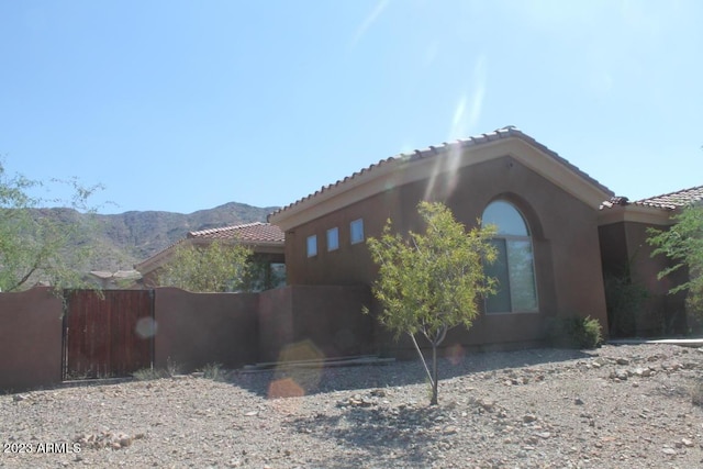 view of property exterior featuring a mountain view